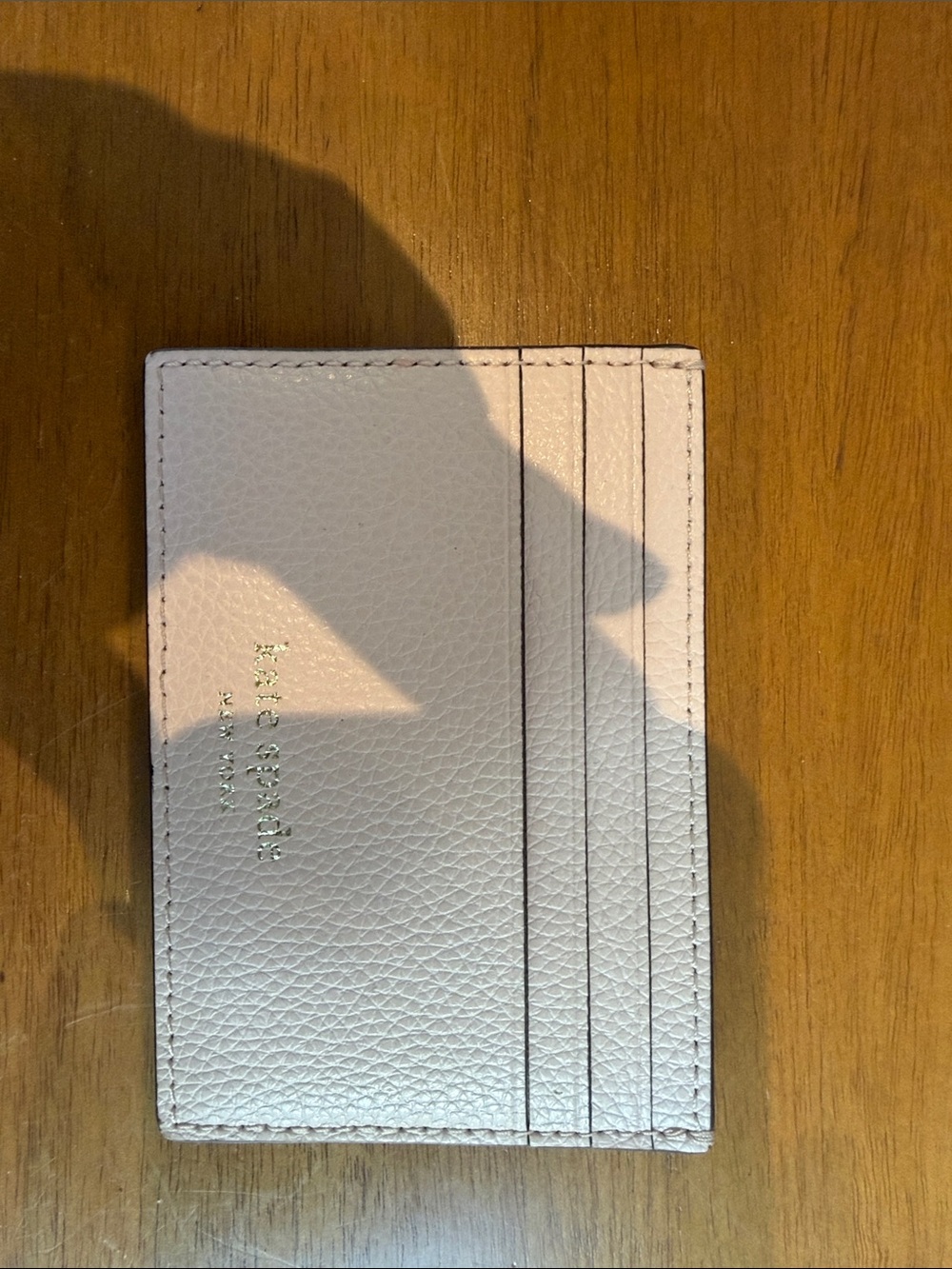 kate spade Pebbled Leather Card Holder in Pale Pink with Gold Logo